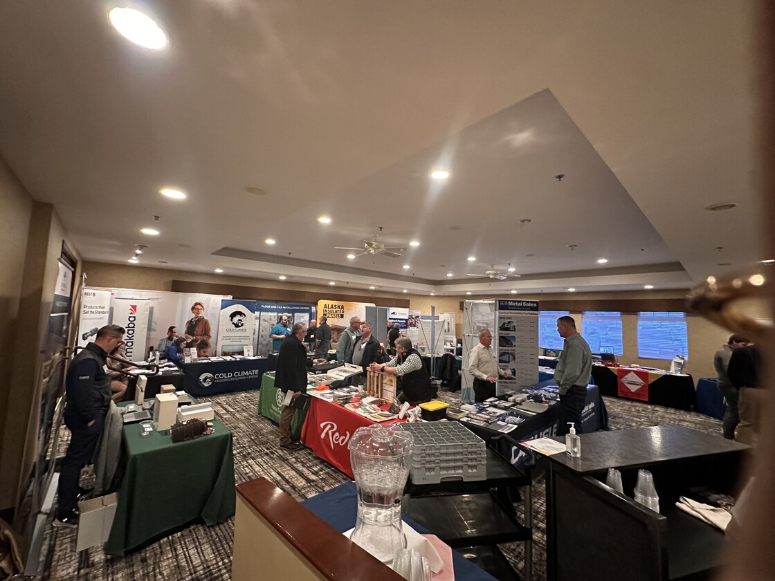 Lively trade show event showcasing diverse booths, networking opportunities, and engaged attendees in 2023.