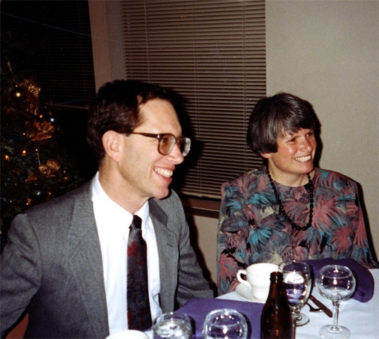 Joyful dinner celebration with friends, festive ambiance, elegant setting, and laughter shared.